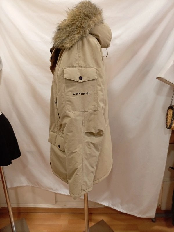 c1c8cfac-73cd-4ef8-8263-e99e5d02bc41.jpeg Parka Carhartt beige con capucha