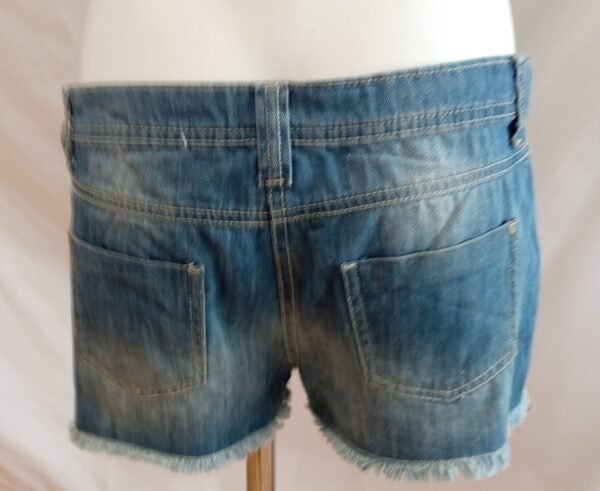 file_00000000728071f49918f057aea52709 Short vaquero con flores margaritas denim talla 40 verano