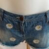 file_00000000a48071f4bd94730e1ea5cfc8 Short vaquero con flores margaritas denim talla 40 verano